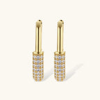 Gold-plated huggie hoop earrings with pavé zirconia stones covering the bottom curve, shown in open and closed positions.