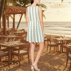 A woman stands on a sandy beach with a restaurant and ocean in the background, wearing a sleeveless fit-and-flare dress with vertical mint green and white stripes.